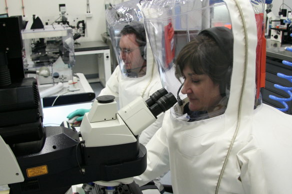 Scientists working in a secure area at CSIRO’s Australian Animal Health Laboratory, a high-containment facility in Geelong.