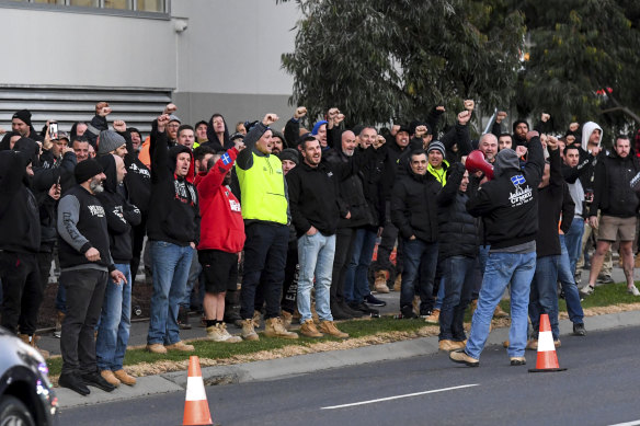 Hundreds of workers protest outside the Hawthorn East building site on July 1 last year.