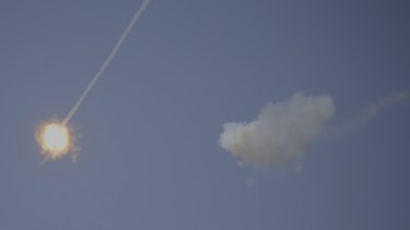 An Israeli Iron Dome air defence system missile is seen intercepting rockets fired from Gaza over Sderot, southern Israel, on Wednesday.