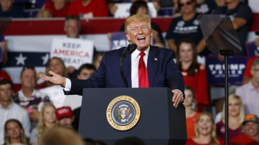 US President Donald Trump speaks at a campaign rally at Williams Arena in Greenville, NC.