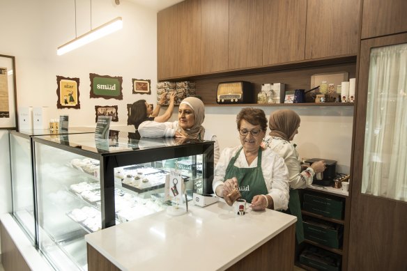 Amal Elhani and her friends at the new Smeed cafe in Belmore, run by daughter Serena.