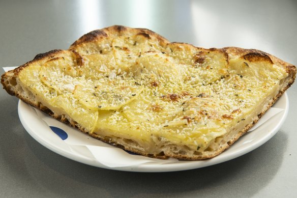 Potato and rosemary pizza slice.