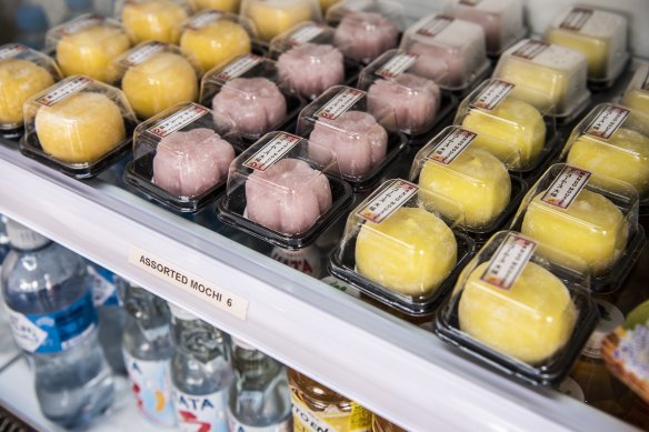 Fridge shelves filled with sweets.