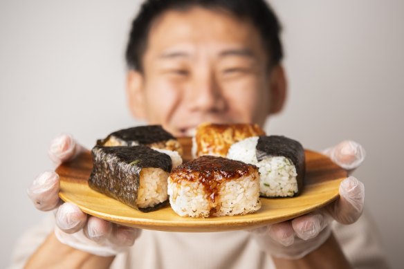 A plate of onigiri held by Comeco Foods  co-owner Masa Haga in Newtown.