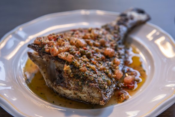 Snapper tail is scored, seasoned and dry-aged for 24 hours before a slow grill on the hibachi and a quick roast.