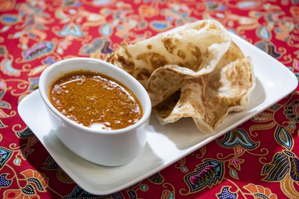 Roti canai and curry sauce.