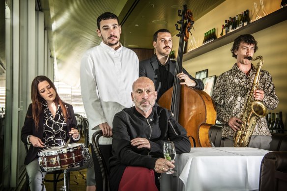 Father and son Maurice Terzini and son Sylvester with live jazz band players at the all-new Jacksons on George.