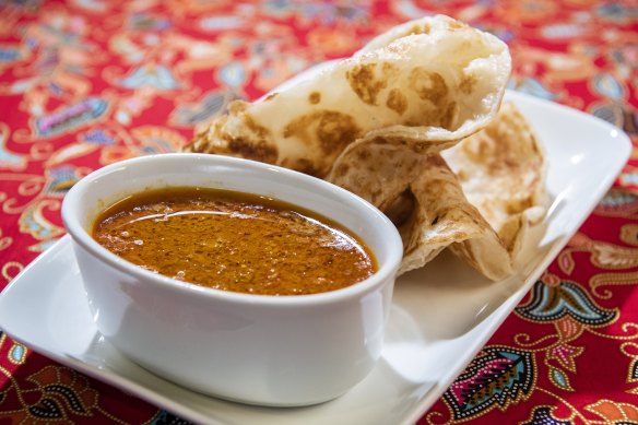 Roti canai and curry sauce.