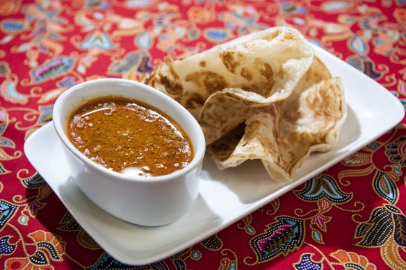 Roti canai and curry sauce.