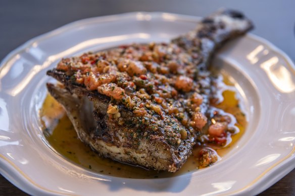 Snapper tail is scored, seasoned and dry-aged for 24 hours before a slow grill on the hibachi and a quick roast.