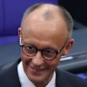 Friedrich Merz of the German Christian Democrats (CDU) is congratulated by colleagues after he won in a second vote in his election as German chancellor.