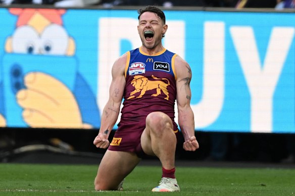 Lachie Neale celebrates his monster goal on the run after being subbed into the grand final at half-time.