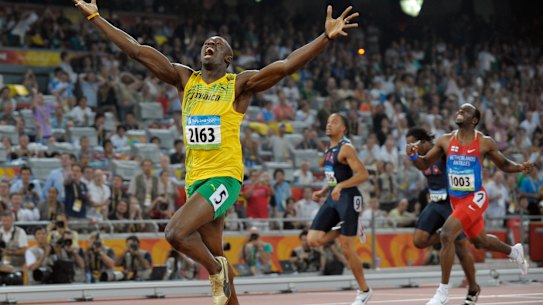 Usain Bolt celebrates as he wins the men’s 200-metre final  at the Beijing Olympics in 2008.