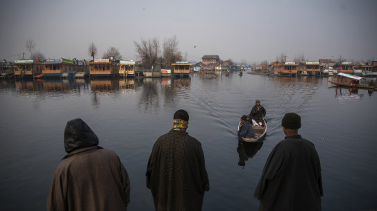 Boat owners at Dal Lake in Kashmir, a once-popular tourist destination in Srinagar.