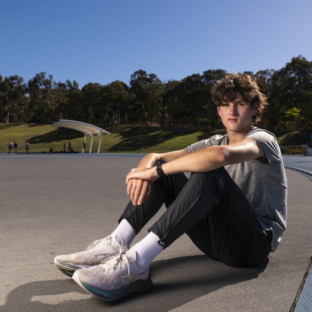 Cameron Myers, the fastest ever 16-year-old miler in history, sits at the AIS track in Canberra.