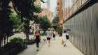 Pedestrians walk along the Hudson Square neighborhood of Manhattan