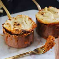 Quick butter chicken pies with naan bread lids.