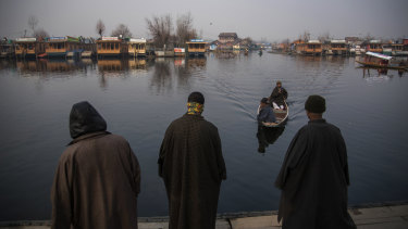 Boat owners at Dal Lake in Kashmir, a once-popular tourist destination in Srinagar.