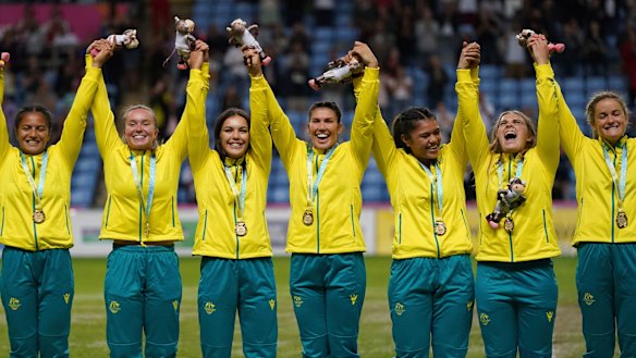 Australia celebrate their rugby sevens gold medal on Sunday night. 