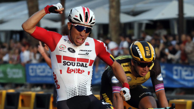 Australia's Caleb Ewan celebrates as he crosses the finish line to win the 21st stage of the Tour de France.