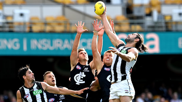 High rise: Collingwood ruckman Brodie Grundy gets above the pack.