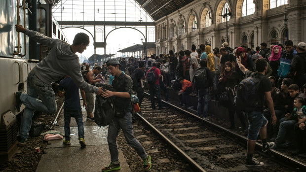 Migrants, mostly from Syria and Afghanistan, at Keleti station in Budapest in September 2015. German Chancellor Angela Merkel's decision to open Germany's doors to these asylum seekers triggered the current debate over immigration between Munich and Berlin.