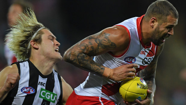 Darcy Moore and Buddy Franklin contest the ball on Saturday night.