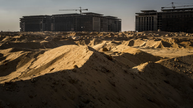 Construction workers in the first phase of Cairo's new capital: over the last two decades China unleashed a global lending spree in an effort to expand its influence and become a political and economic superpower. 