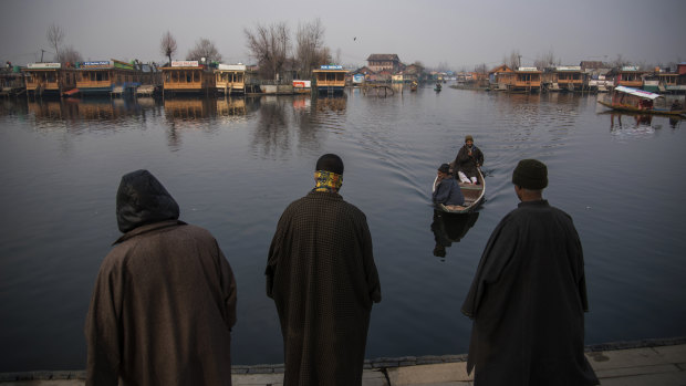 Boat owners at Dal Lake in Kashmir, a once-popular tourist destination in Srinagar.