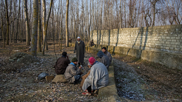 Villagers drink tea Kashmir's northern district of Bandipora.