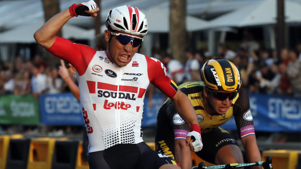 Australia's Caleb Ewan celebrates as he crosses the finish line to win the 21st stage of the Tour de France.