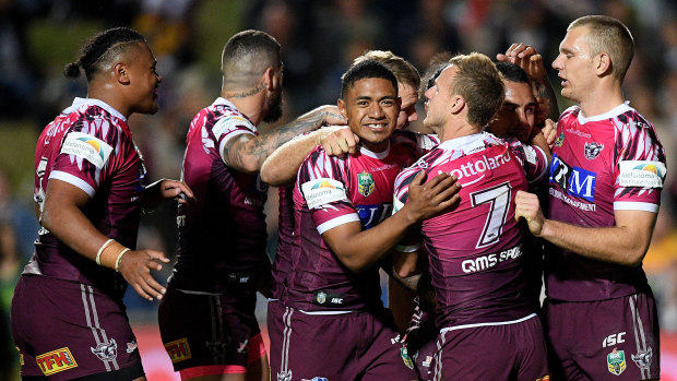 Jubilant: Addin Fonua-Blake, second right, is mobbed after scoring.