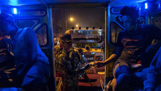 Soldiers halt vehicles for inspection at the entrance to Zamboanga in the southern Philippines in February.
