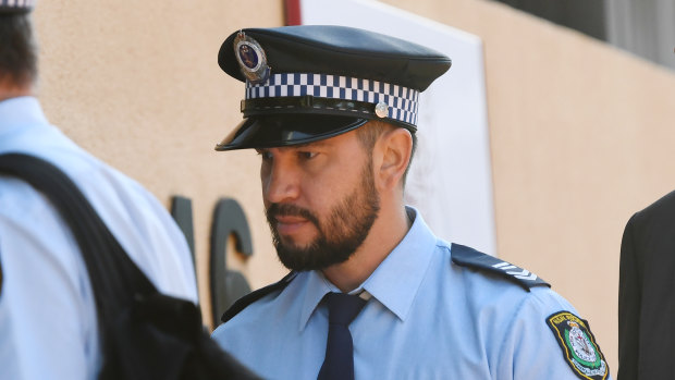 Senior Constable Ethan Tesoriero arrives at the inquest into the police shooting death of Courtney Topic.