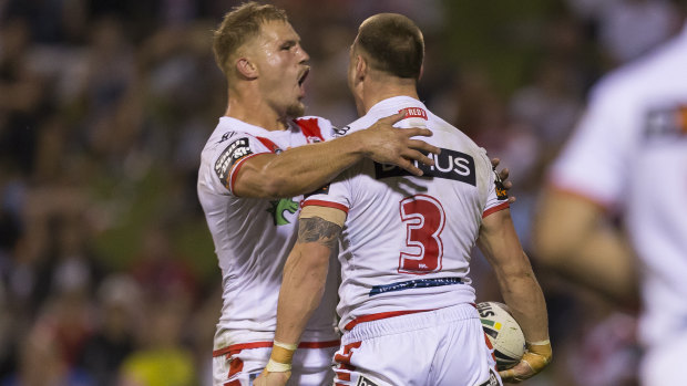 Jack de Belin and Euan Aitken celebrate a Dragons try on Friday night.