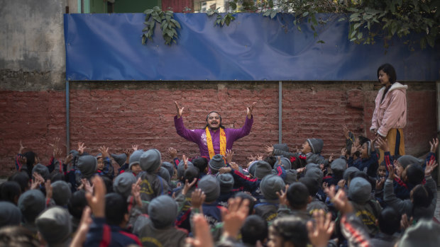 Brishadev Gorakshadas, a teacher, leads a yoga class at Mount Genius English School in Kathmandu.