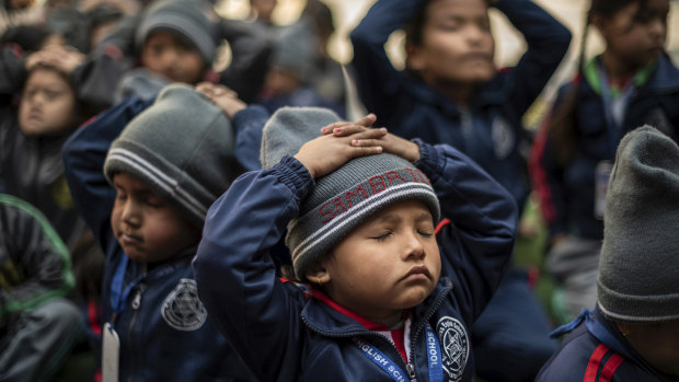 Children take part in a yoga class at Mount Genius English School, in Kathmandu.