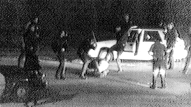 Police officers beat Rodney King on a Los Angeles freeway.
