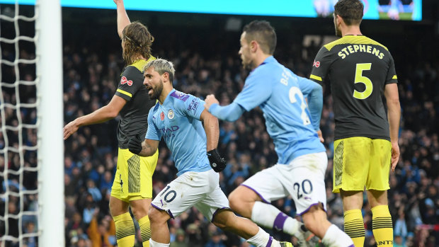 Sergio Aguero celebrates after scoring Manchester City's opening goal.