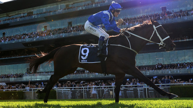 Power and grace: Winx takes the Queen Elizabeth Stakes at Randwick on Saturday.