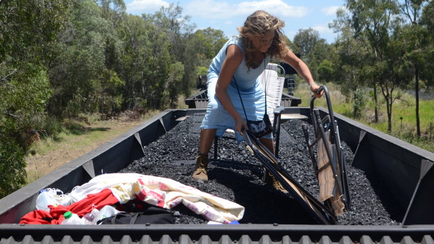 The zoology student climbed on top of a coal train and was confronted by police near the Port of Brisbane.
