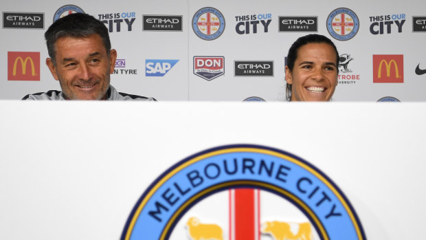 Winners are grinners: City coach Rado Vidosic with goalkeeper Lydia Williams.