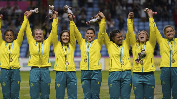 Australia celebrate their rugby sevens gold medal on Sunday night. 