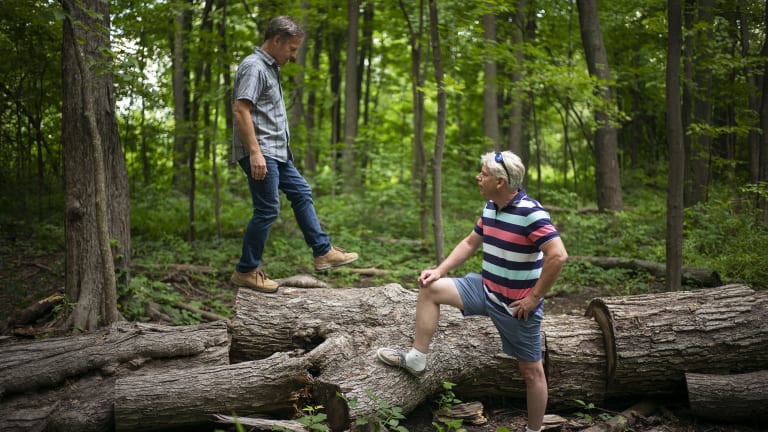 Bill Konduros, left, and his brother Jay walk at a park in Mississauga, Canada. After managing their haemophilia for their entire lives, the Konduros brothers appear to have been cured by gene therapy. 