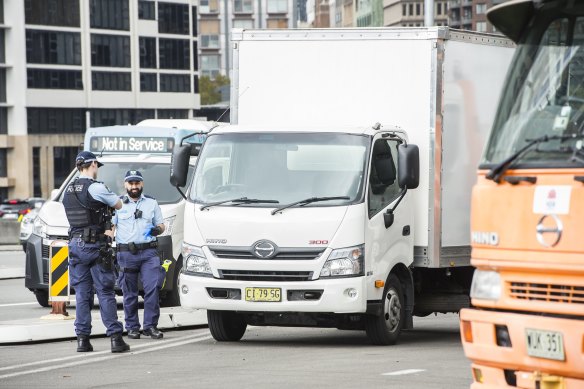 Police next to the truck that was used to block a lane on the Sydney Harbour Bridge on Wednesday morning.