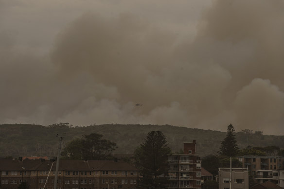 A hazard reduction that jumped containment lines has spread thick smoke across the city. 