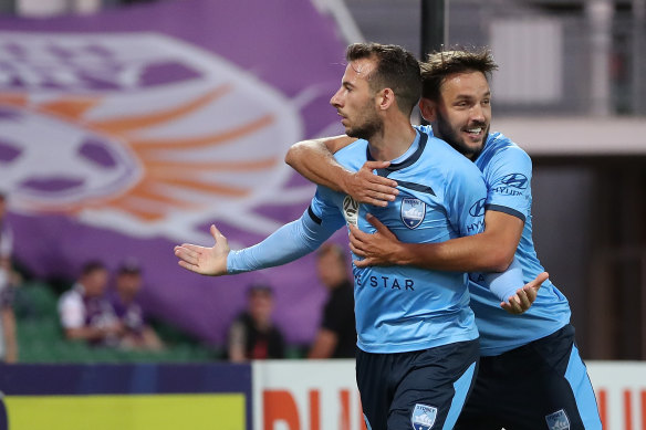 Milos Ninkovic celebrates with Adam Le Fondre, who scored the penalty that the Serbian midfielder drew against Perth Glory.