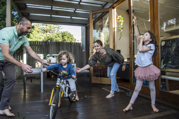Caroline Willis and Lionel Bonnafous and their children, Emmanuelle, with home-made bow and arrow, and Theodore, who is learning to ride his new bike.