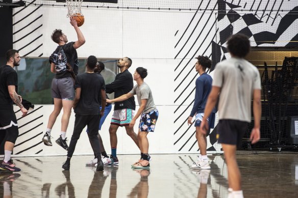 Nick Kyrgios in action with some of his new mates at King George V Recreation Centre last month.