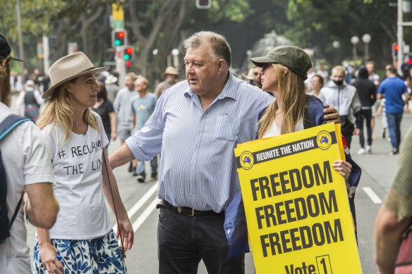 Craig Kelly, centre, at a “freedom” rally in Sydney on November 20.